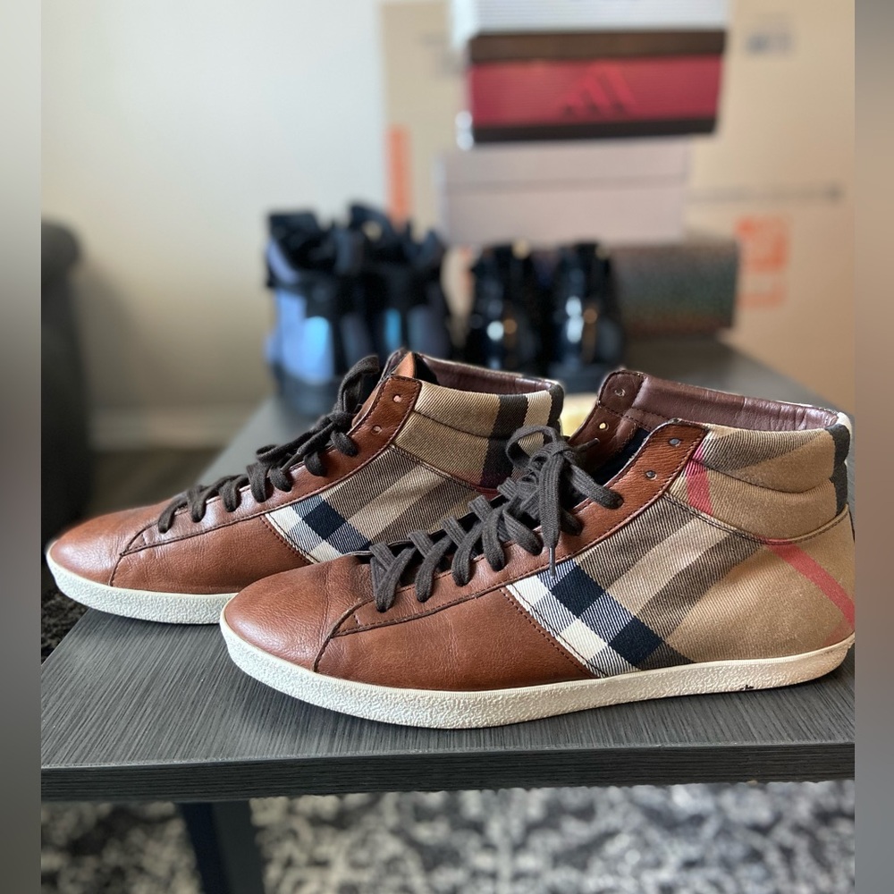 Burberry high top sneakers.